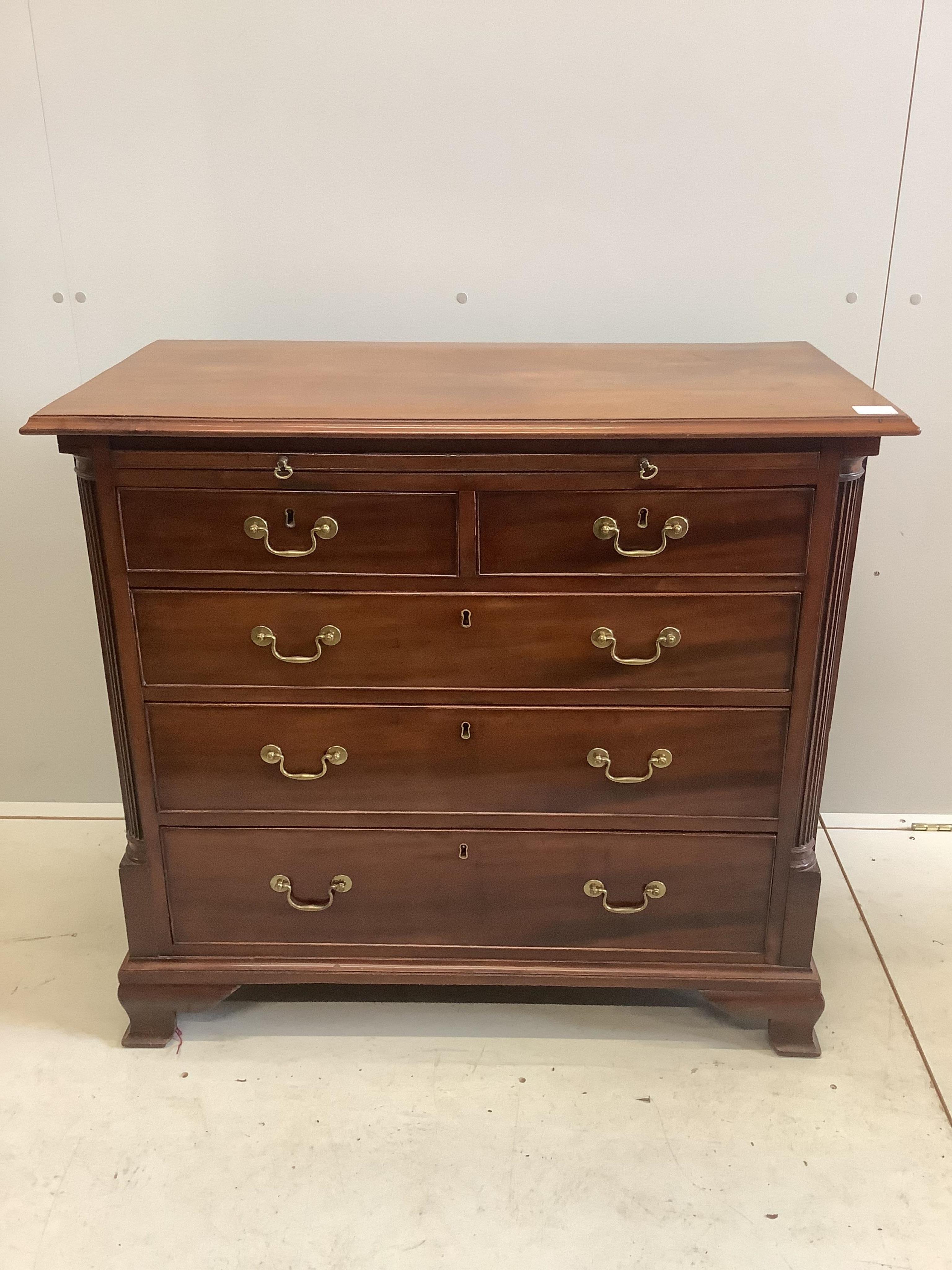 A George III mahogany chest of drawers with brushing slide, width 33cm, depth 47cm, height 85cm. Condition - good